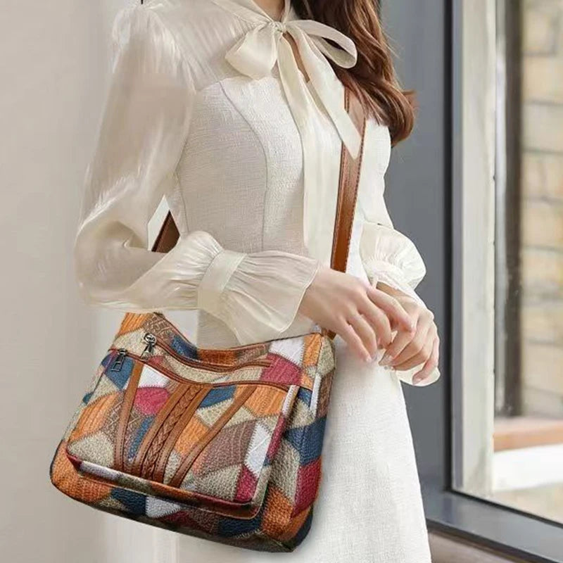 Lady's mother bag with geometric pattern design, suitable for traveling and shopping. Made of PU material.